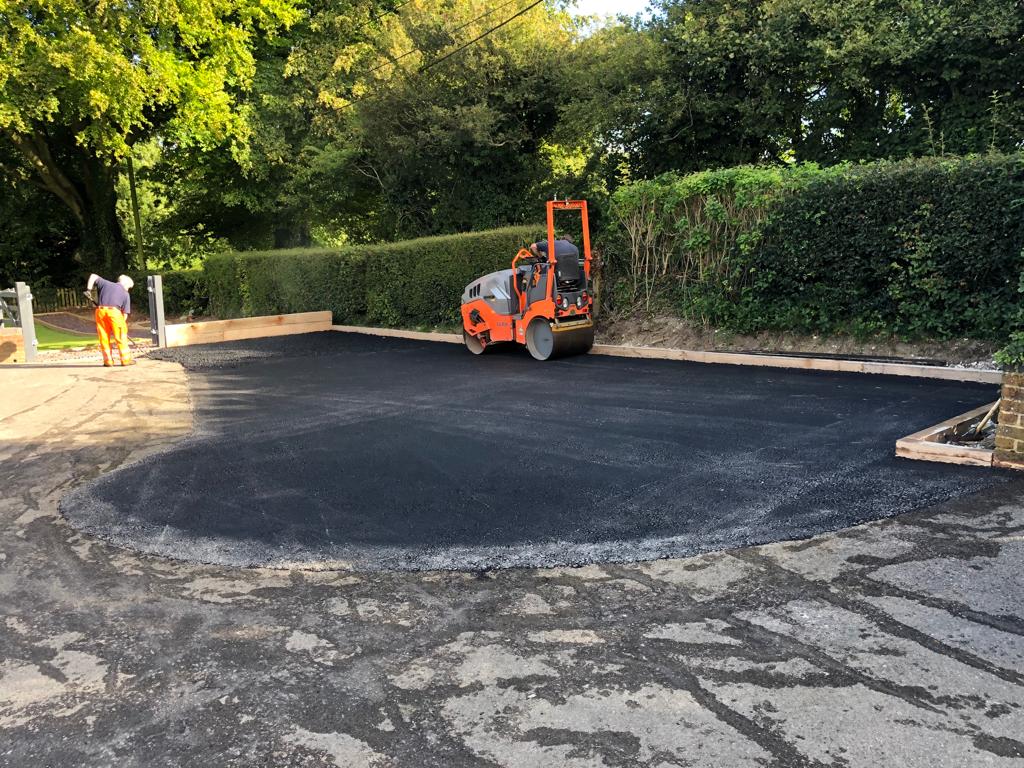 This is a photo of a bitumen driveway which is in the process of being installed by Aratula Asphalt & Bitumen Surfacing